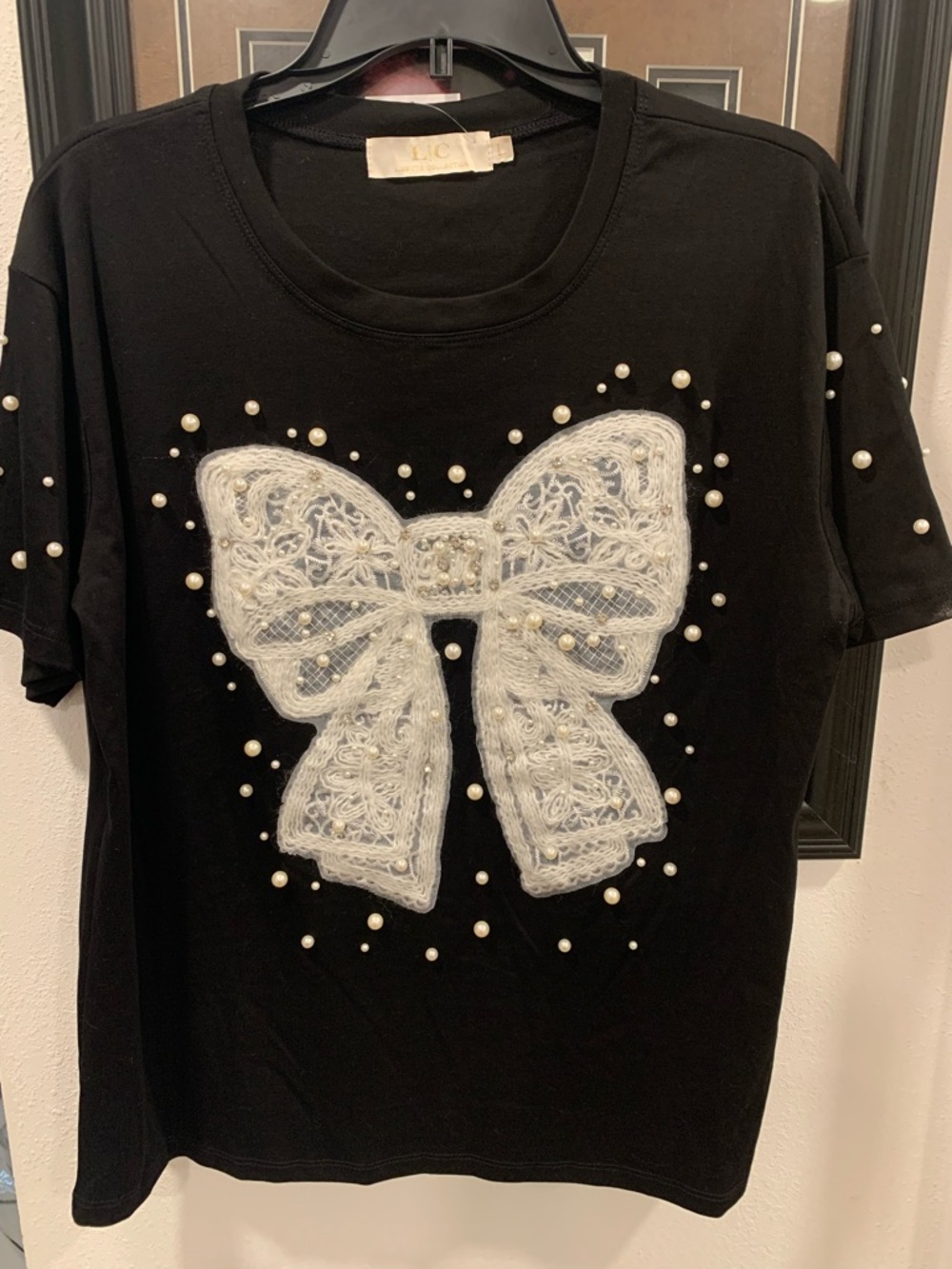 LC Waikiki Black Short Sleeve Tee with White Bow and Pearl Accents